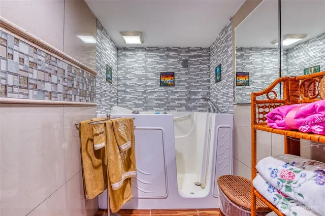 a bathroom with a sink toilet and mirror