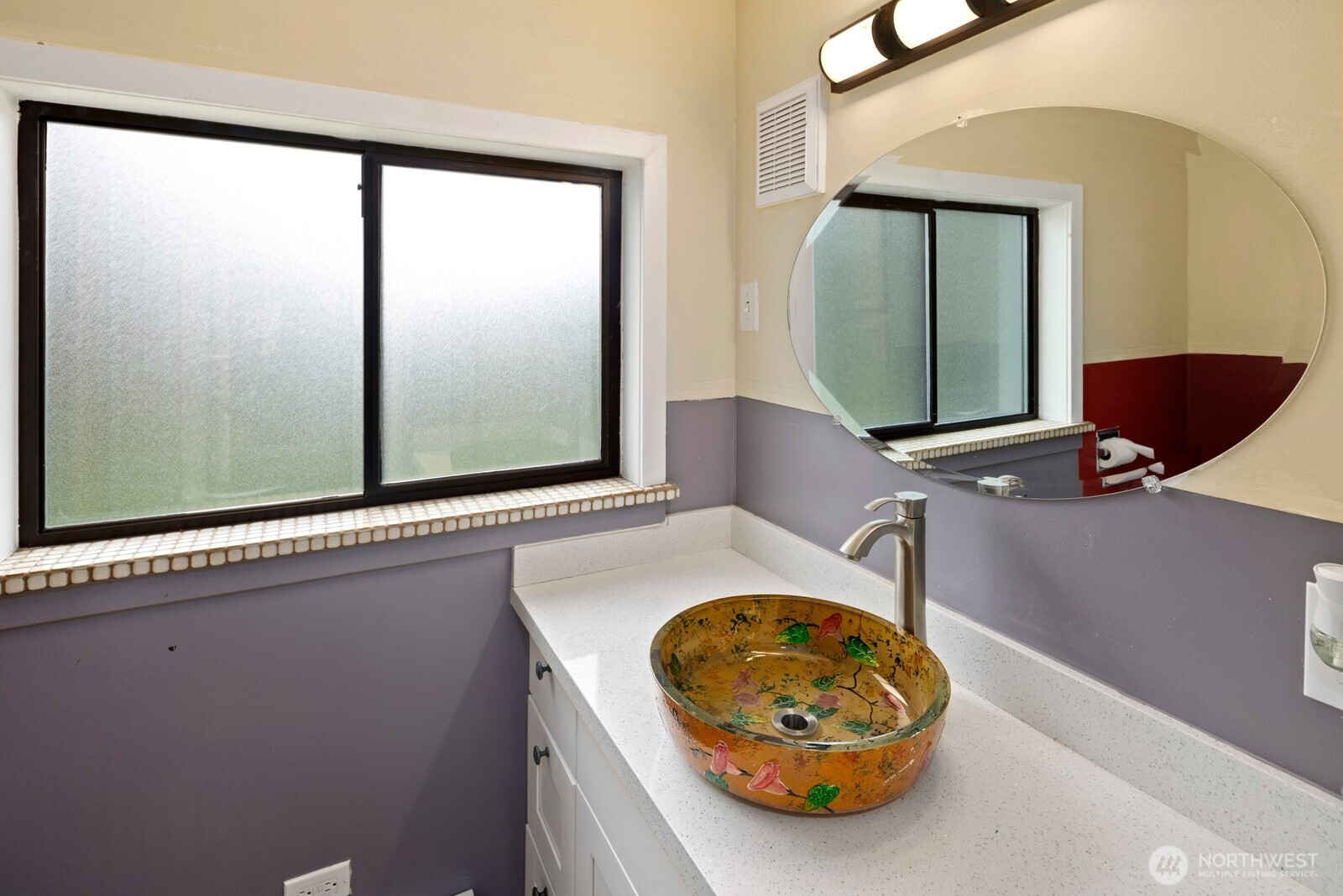 10008 Rainier Avenue South Seattle, WA 98178 - Photo 36 of 40 a bathroom with a sink and mirror