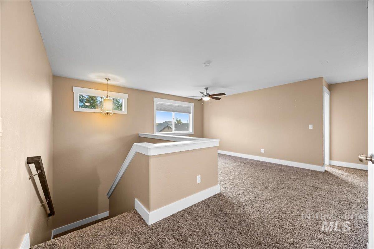 13557 Signorello Street Caldwell, ID 83607 - Photo 23 of 30 Empty room featuring carpet and baseboards