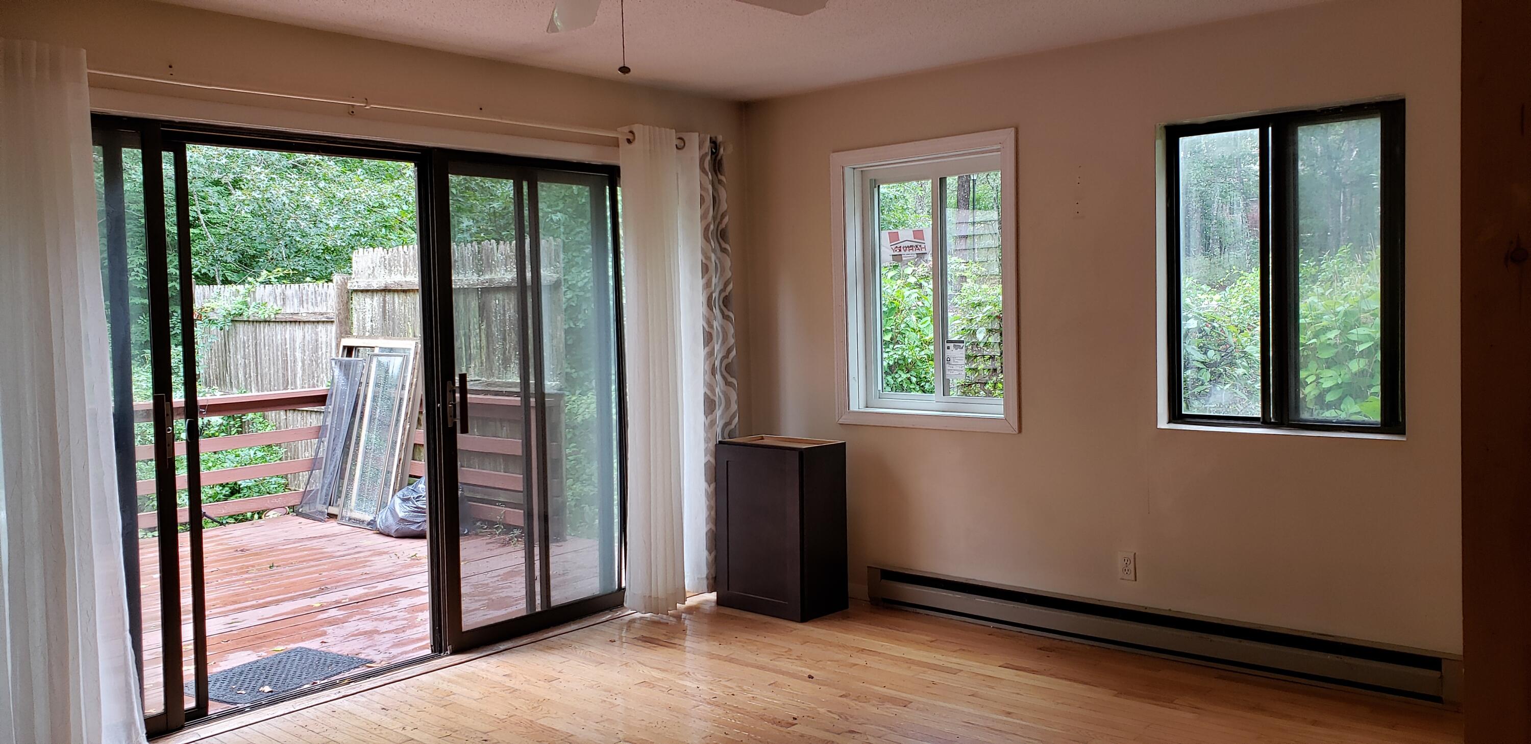 38 Round House Road, Unit 38 Bourne, MA 02532 - Photo 2 of 8 an empty room with windows