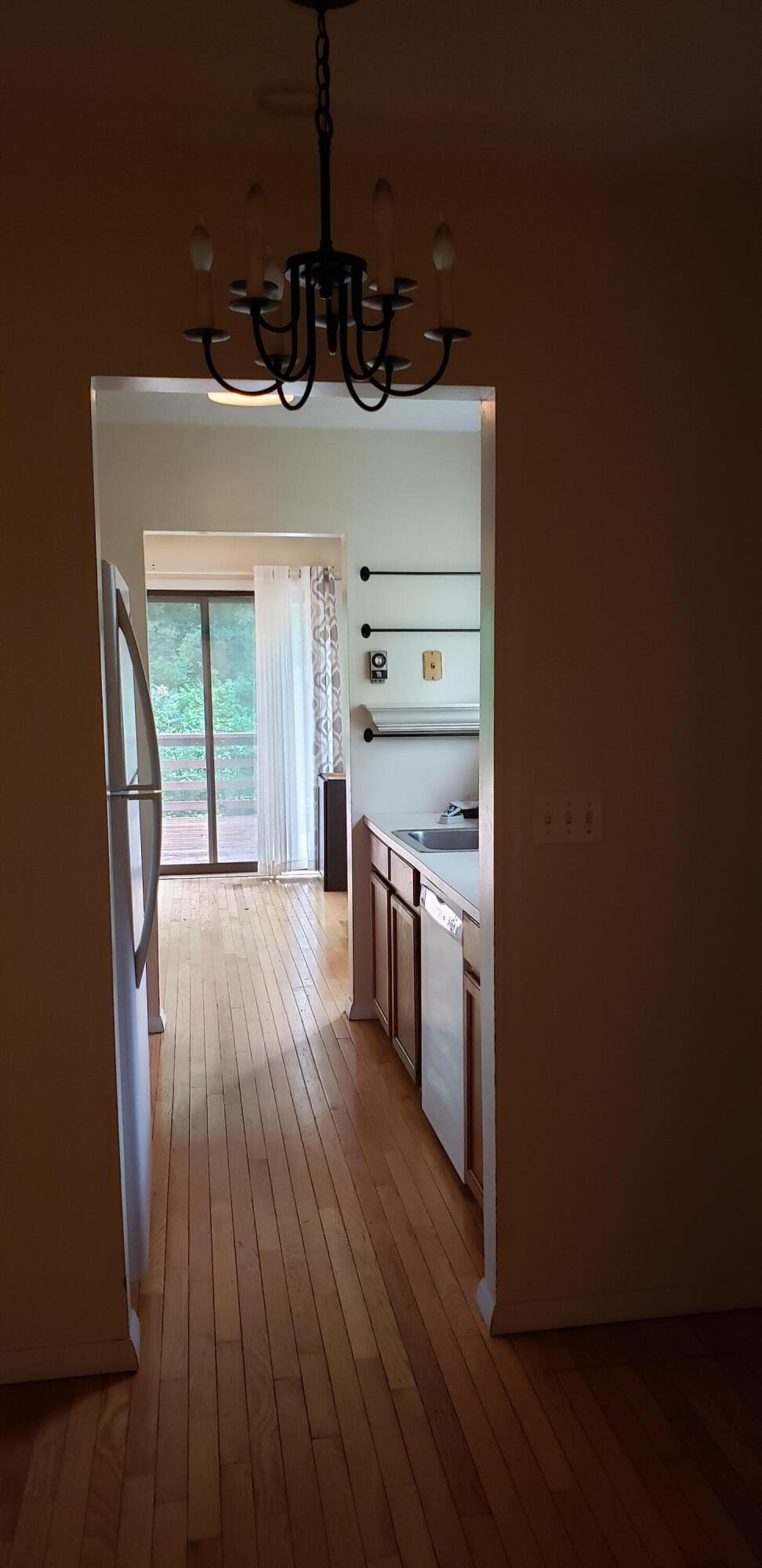 38 Round House Road, Unit 38 Bourne, MA 02532 - Photo 6 of 8 a kitchen with stainless steel appliances a stove and wooden floor