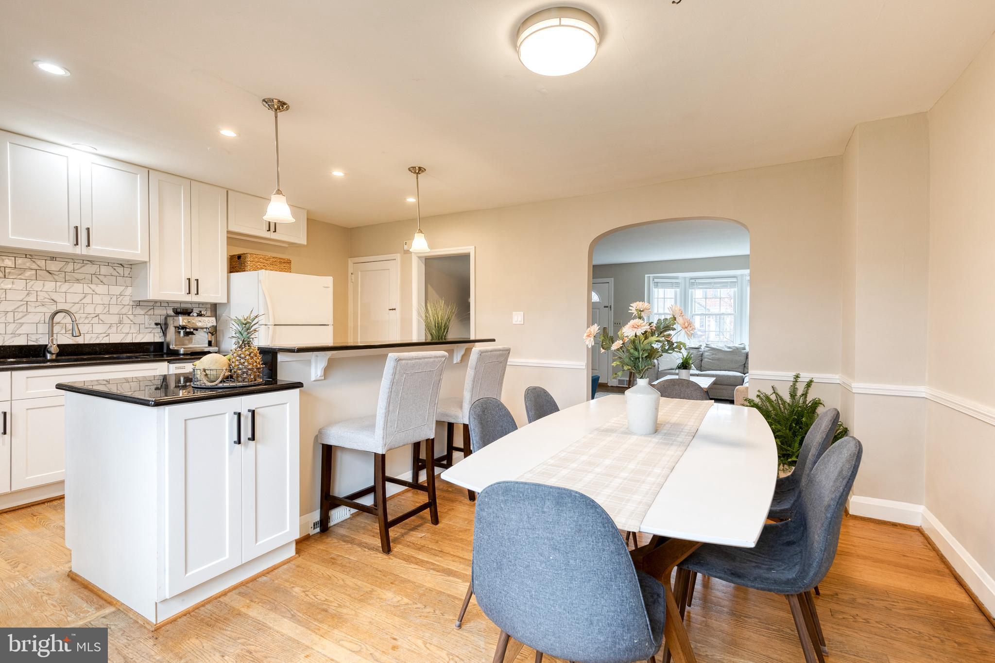 31 Regester Avenue Baltimore, MD 21212 - Photo 15 of 38 a view of a dining room with furniture and wooden floor