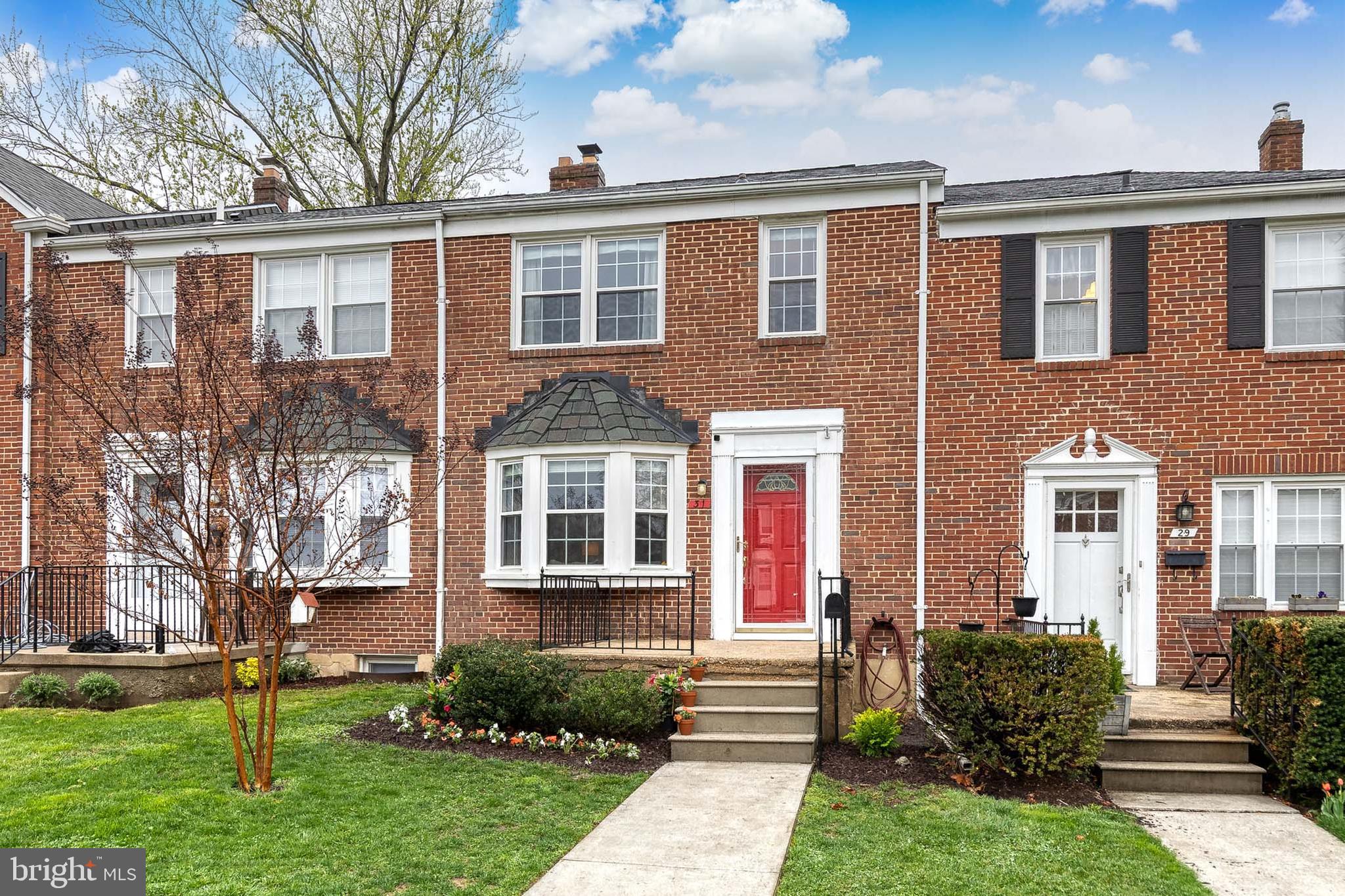 31 Regester Avenue Baltimore, MD 21212 - Photo 2 of 38 front view of a house with a yard