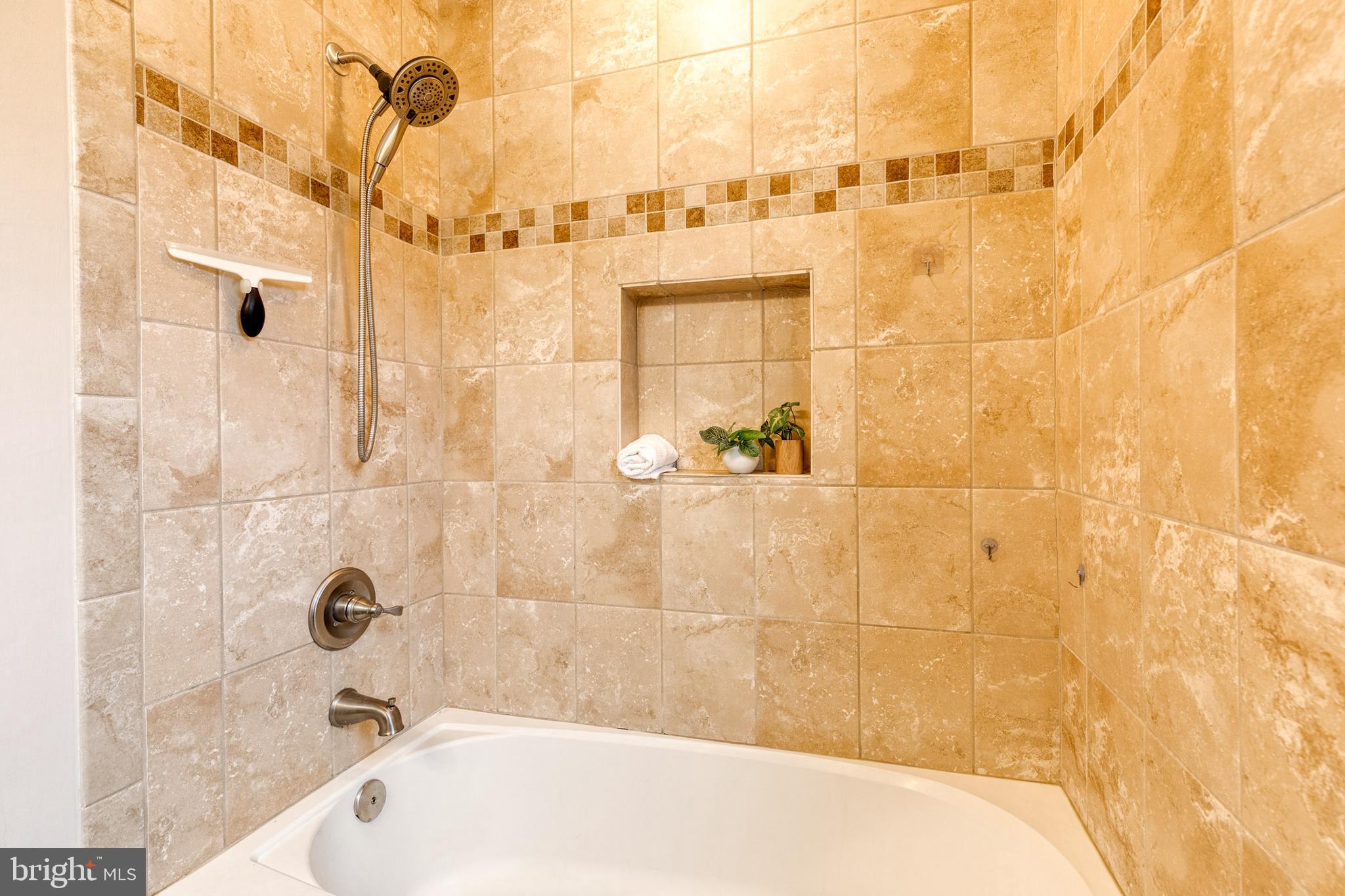 31 Regester Avenue Baltimore, MD 21212 - Photo 34 of 38 a bathroom with a bathtub and shower