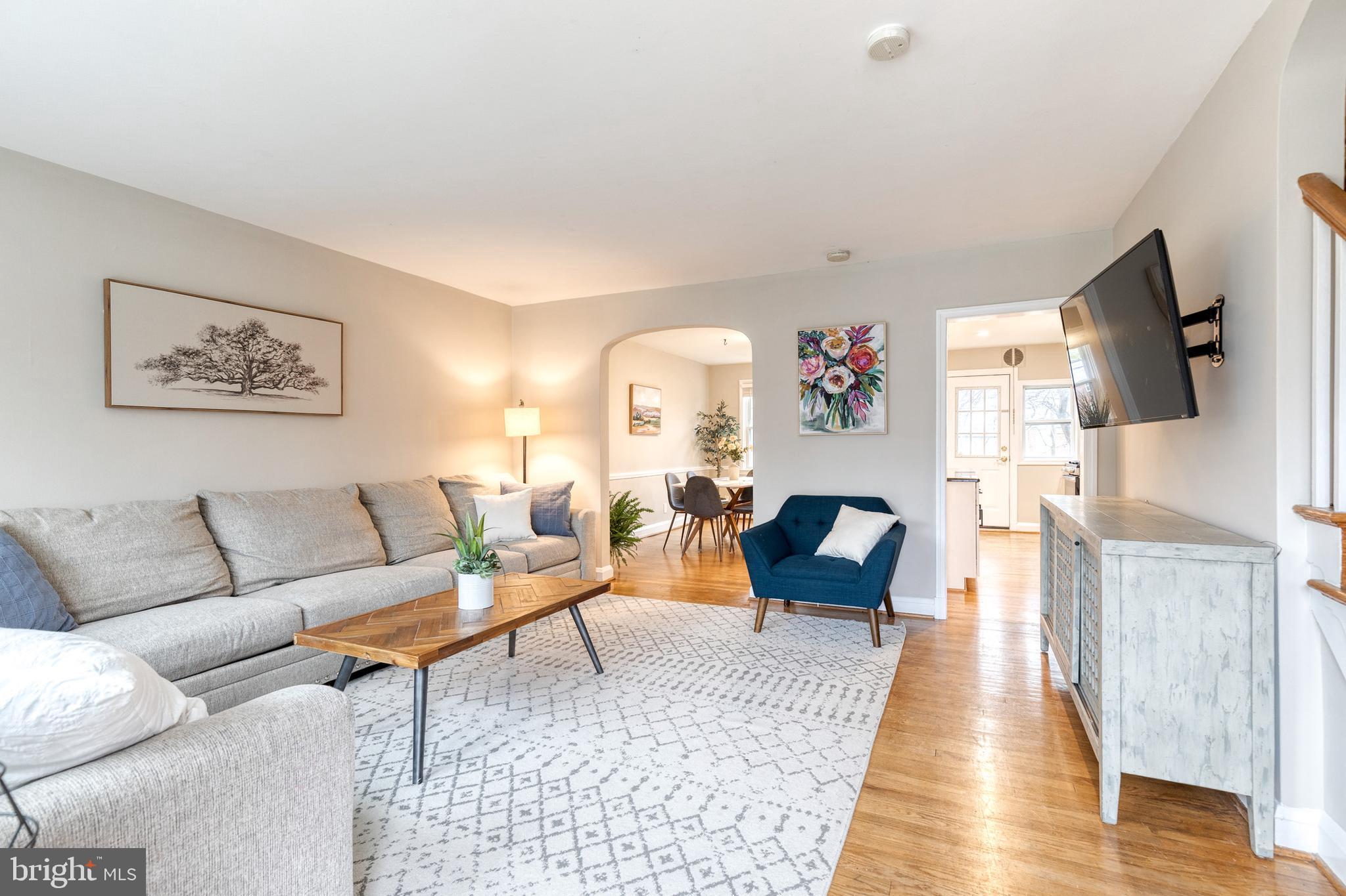 31 Regester Avenue Baltimore, MD 21212 - Photo 4 of 38 a living room with furniture and a flat screen tv