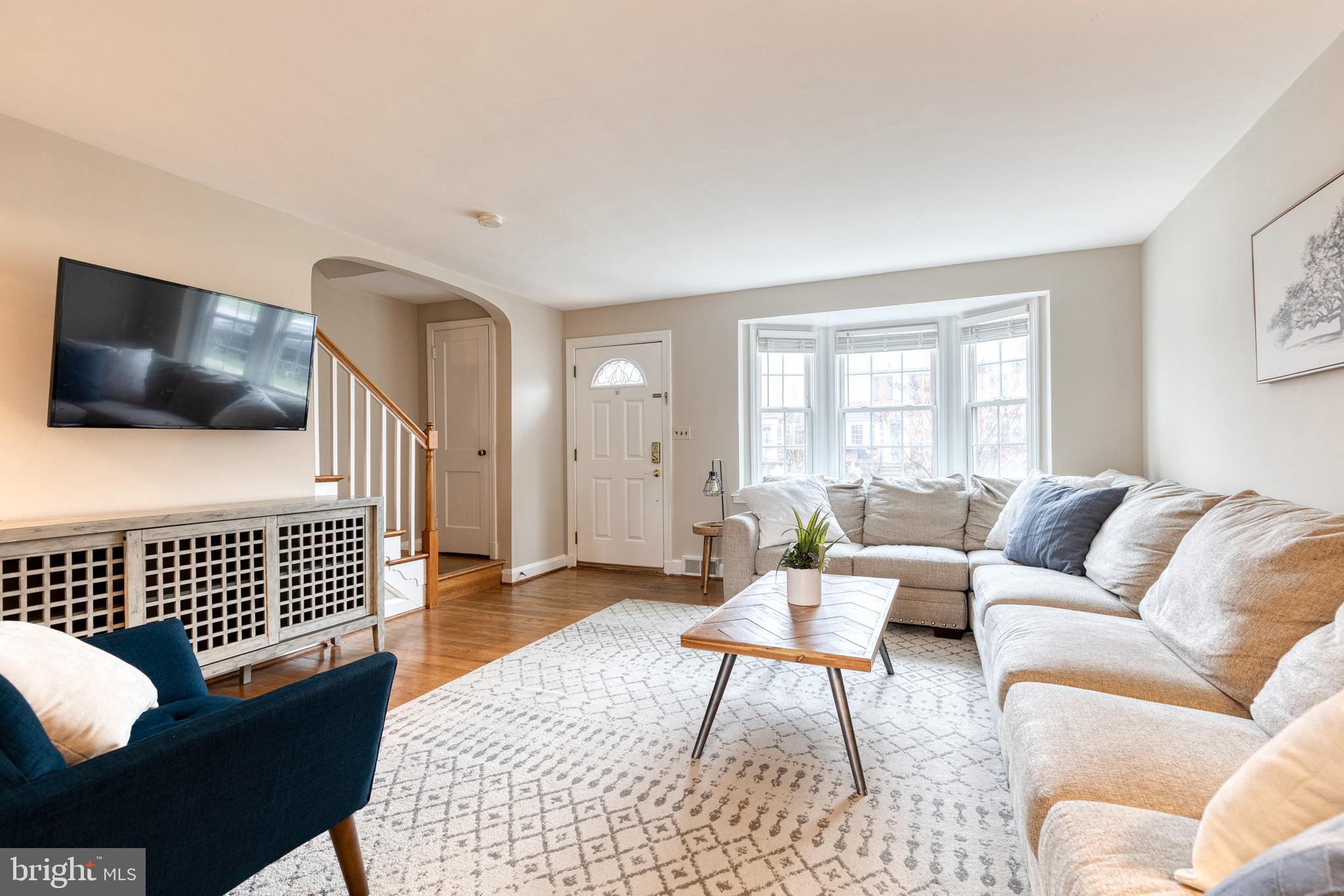 31 Regester Avenue Baltimore, MD 21212 - Photo 7 of 38 a living room with furniture and a flat screen tv