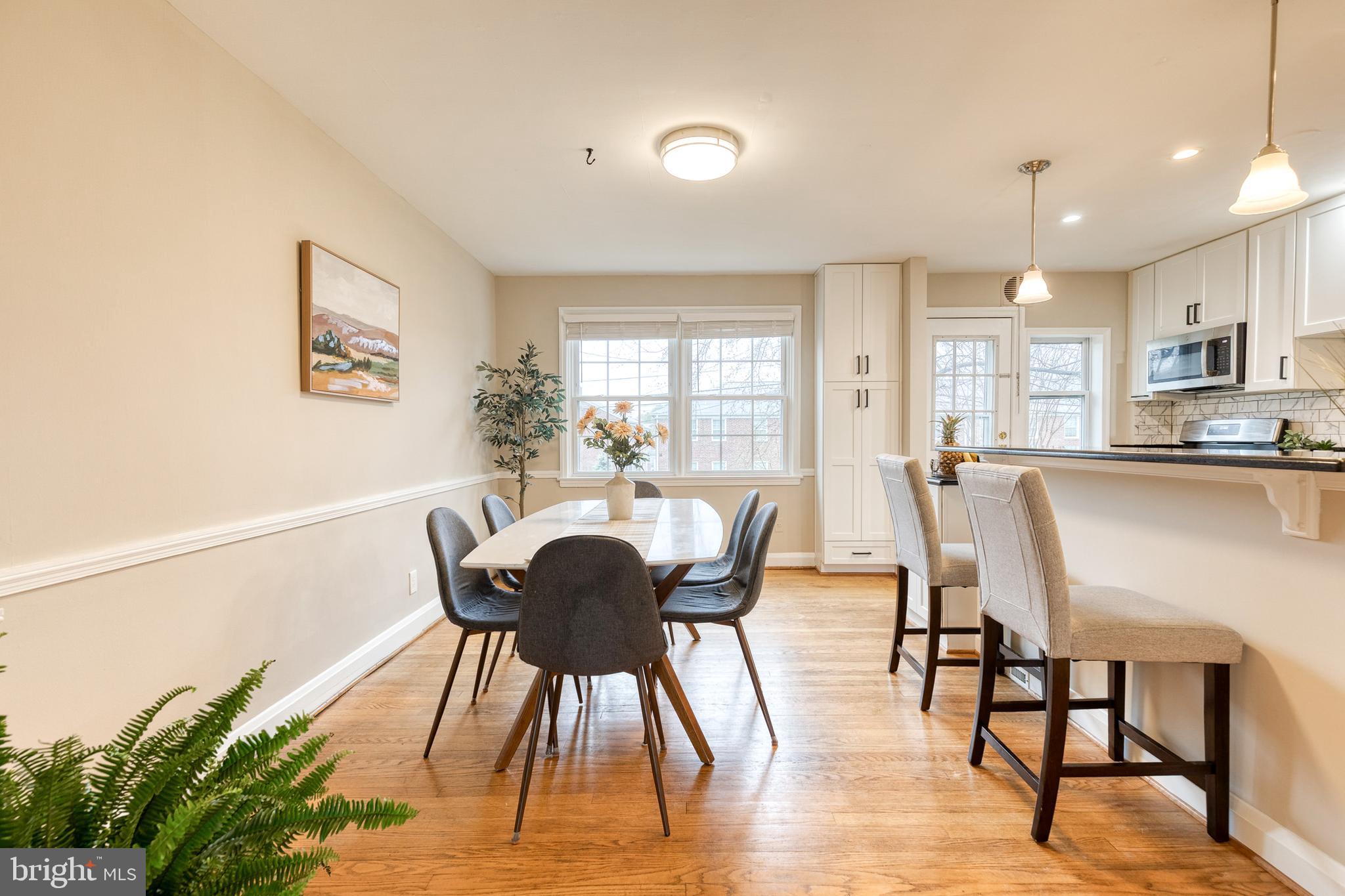 31 Regester Avenue Baltimore, MD 21212 - Photo 9 of 38 a view of a dining room with furniture window and wooden floor