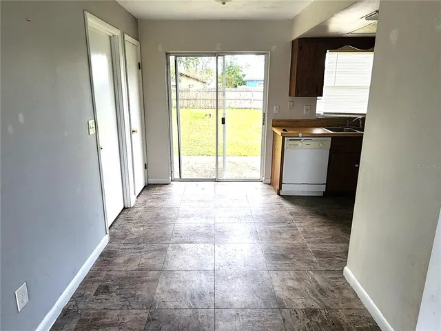 a view of a kitchen with a sink and a window