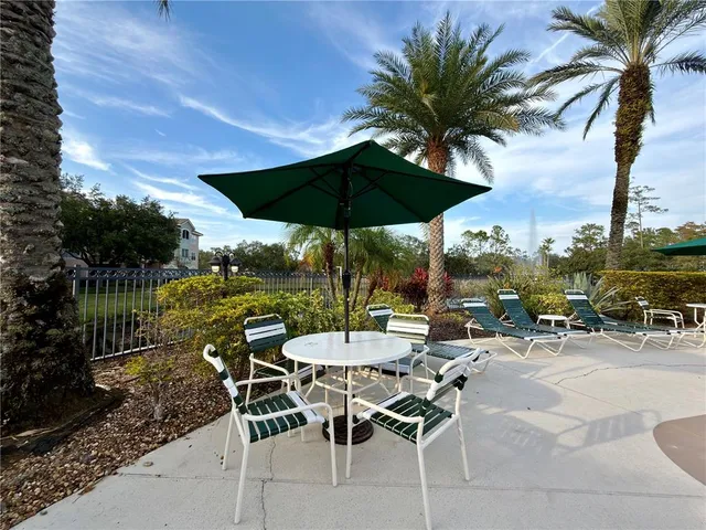 a view of a backyard with sitting area and furniture