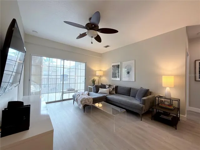 a living room with furniture and a large window