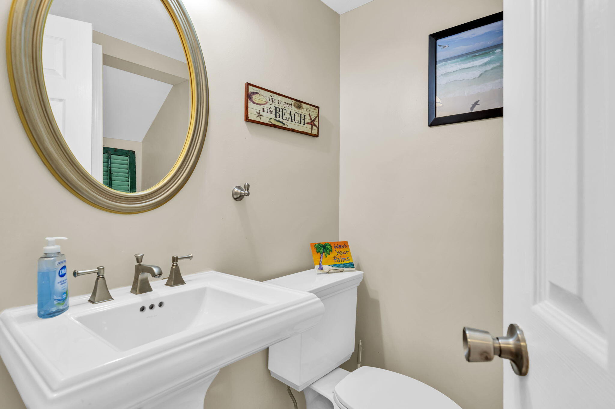 288 Ellis Road, Unit 114 Miramar Beach, FL 32550 - Photo 15 of 30 a bathroom with a sink mirror and toilet