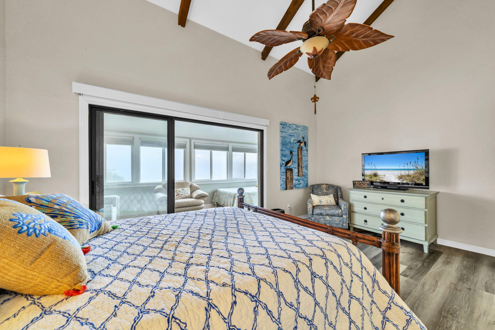288 Ellis Road, Unit 114 Miramar Beach, FL 32550 - Photo 17 of 30 a bedroom with a bed and a flat tv screen on dresser