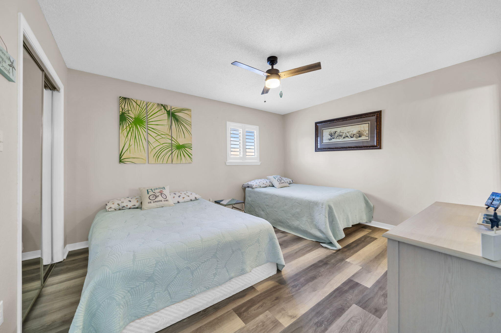 288 Ellis Road, Unit 114 Miramar Beach, FL 32550 - Photo 23 of 30 a bedroom with two beds and painting on the wall