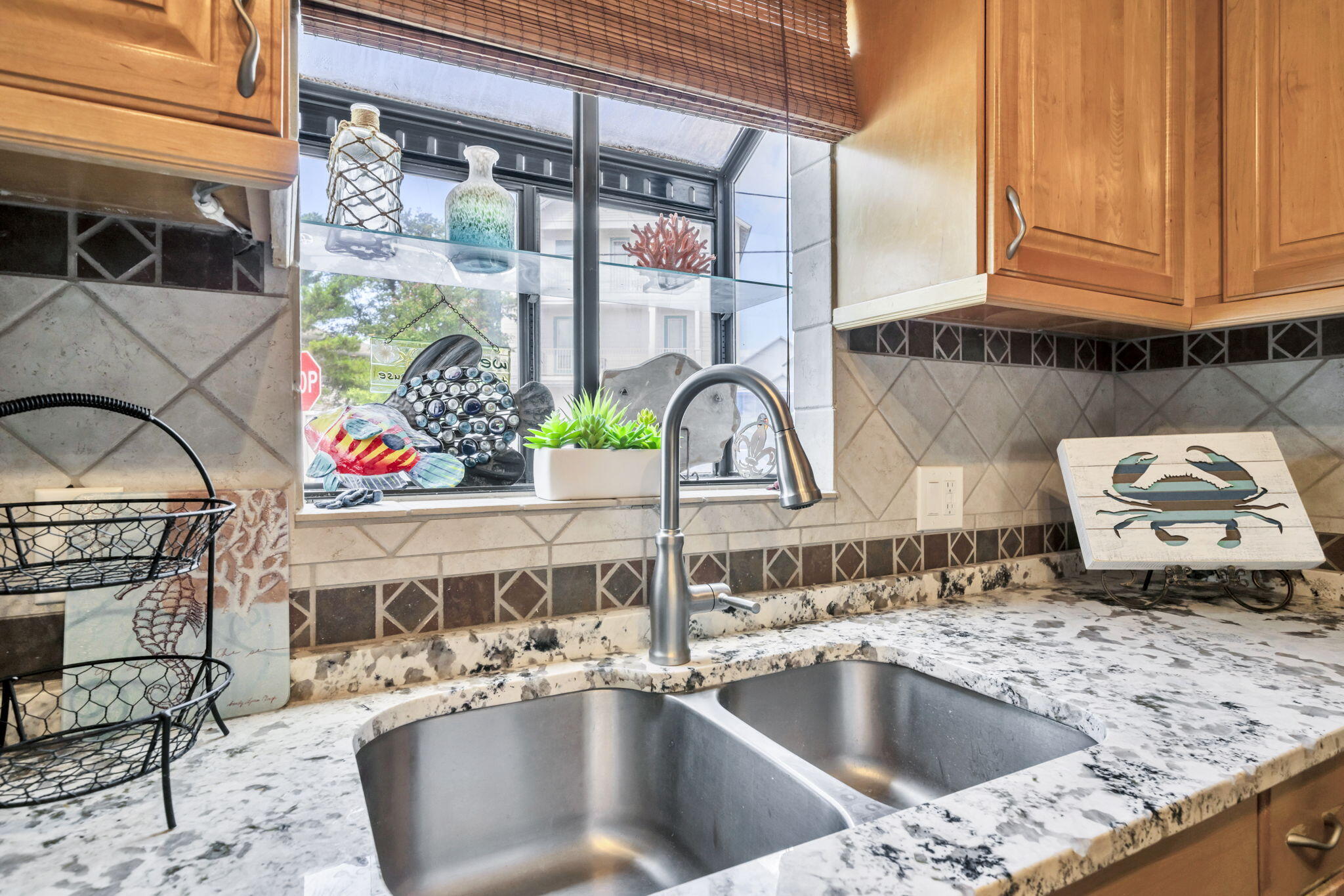 288 Ellis Road, Unit 114 Miramar Beach, FL 32550 - Photo 5 of 30 a kitchen sink with granite countertop a sink and a stove