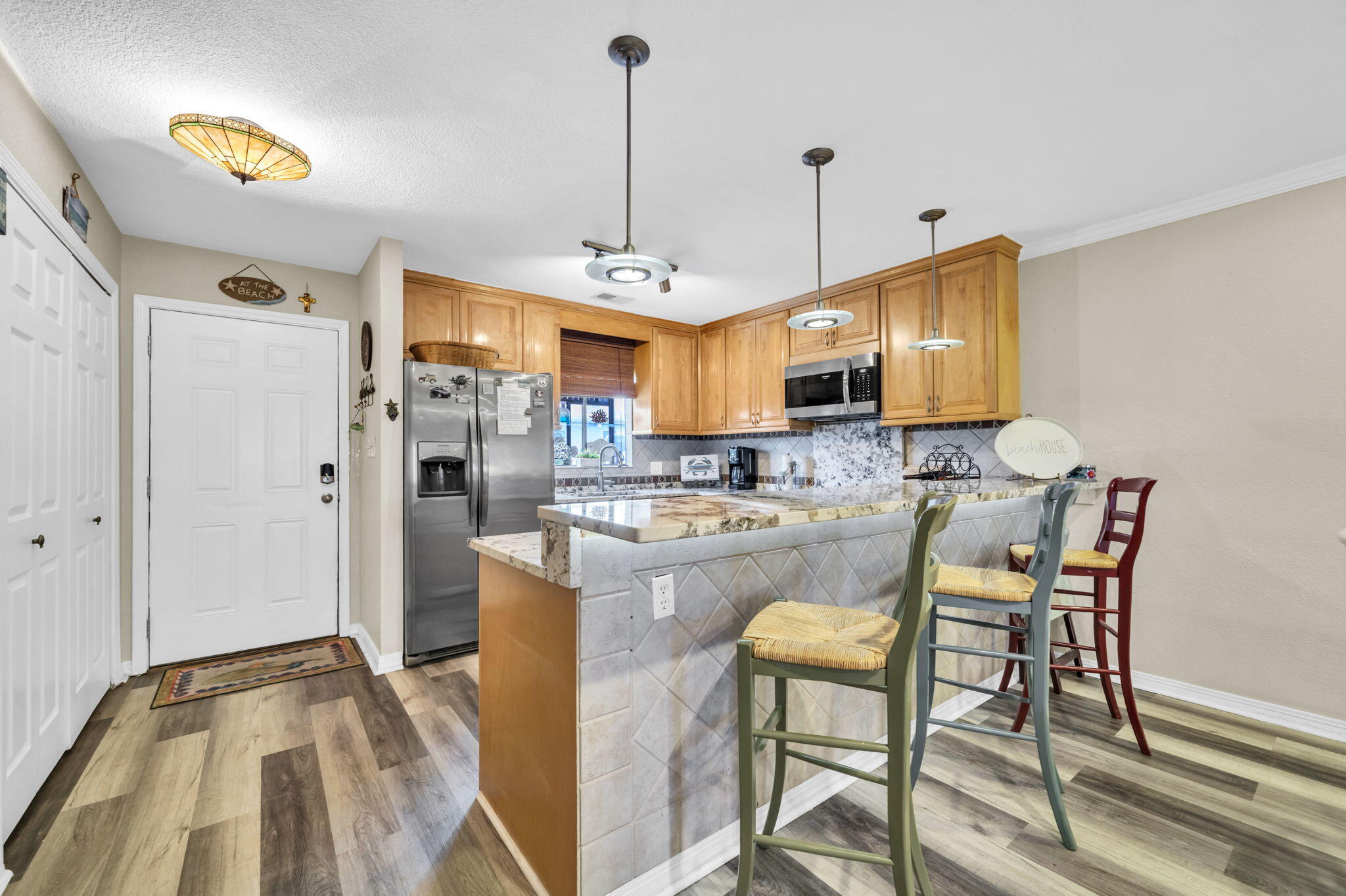288 Ellis Road, Unit 114 Miramar Beach, FL 32550 - Photo 7 of 30 a view of a kitchen and dining room