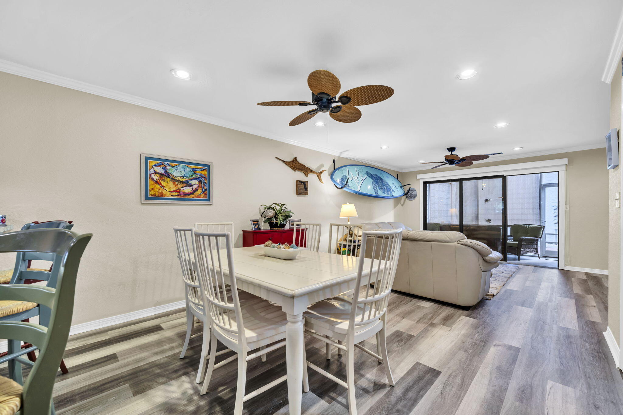 288 Ellis Road, Unit 114 Miramar Beach, FL 32550 - Photo 8 of 30 a view of a dining room with furniture and wooden floor