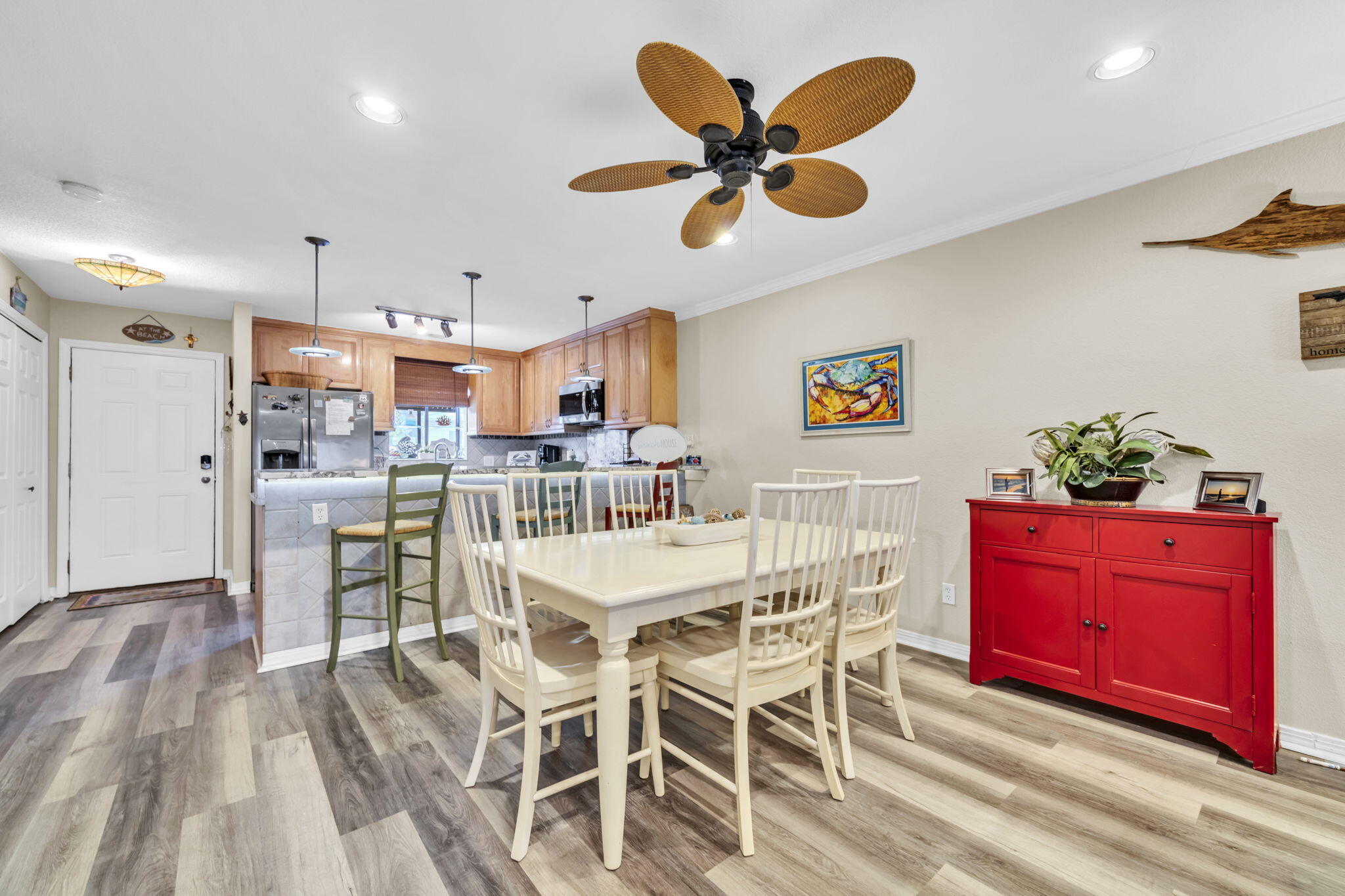 288 Ellis Road, Unit 114 Miramar Beach, FL 32550 - Photo 9 of 30 a view of a dining room with furniture and a chandelier