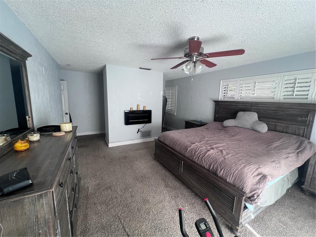 357 Tymber Run Ormond Beach, FL 32174 - Photo 7 of 32 a bedroom with a bed and a flat screen tv