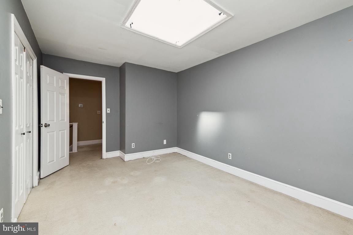 918 North Calvert Street, Unit D Baltimore, MD 21202 - Photo 21 of 35 Bedroom 1 with huge skylight
