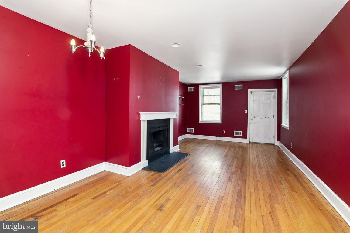 918 North Calvert Street, Unit D Baltimore, MD 21202 - Photo 5 of 35 Living Room with door to rear deck
