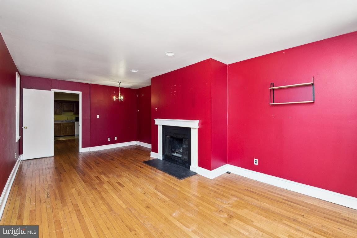 918 North Calvert Street, Unit D Baltimore, MD 21202 - Photo 7 of 35 Living Room with door to rear deck