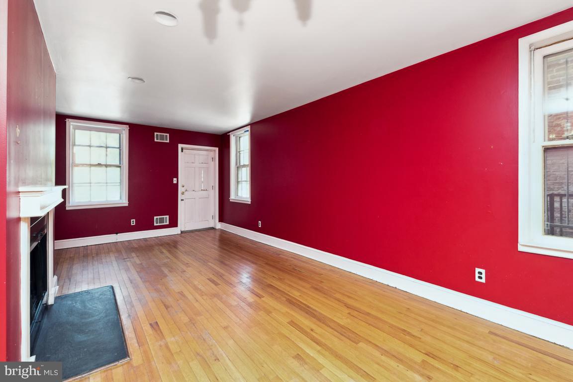 918 North Calvert Street, Unit D Baltimore, MD 21202 - Photo 9 of 35 Living Room with door to rear deck