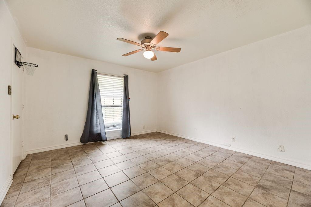298 Butterfield Road Denison, TX 75021 - Photo 15 of 34 Room featuring neutral ceramic tile flooring and white painted walls
