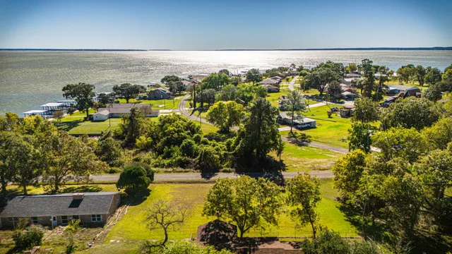 a view of a swimming pool with a yard