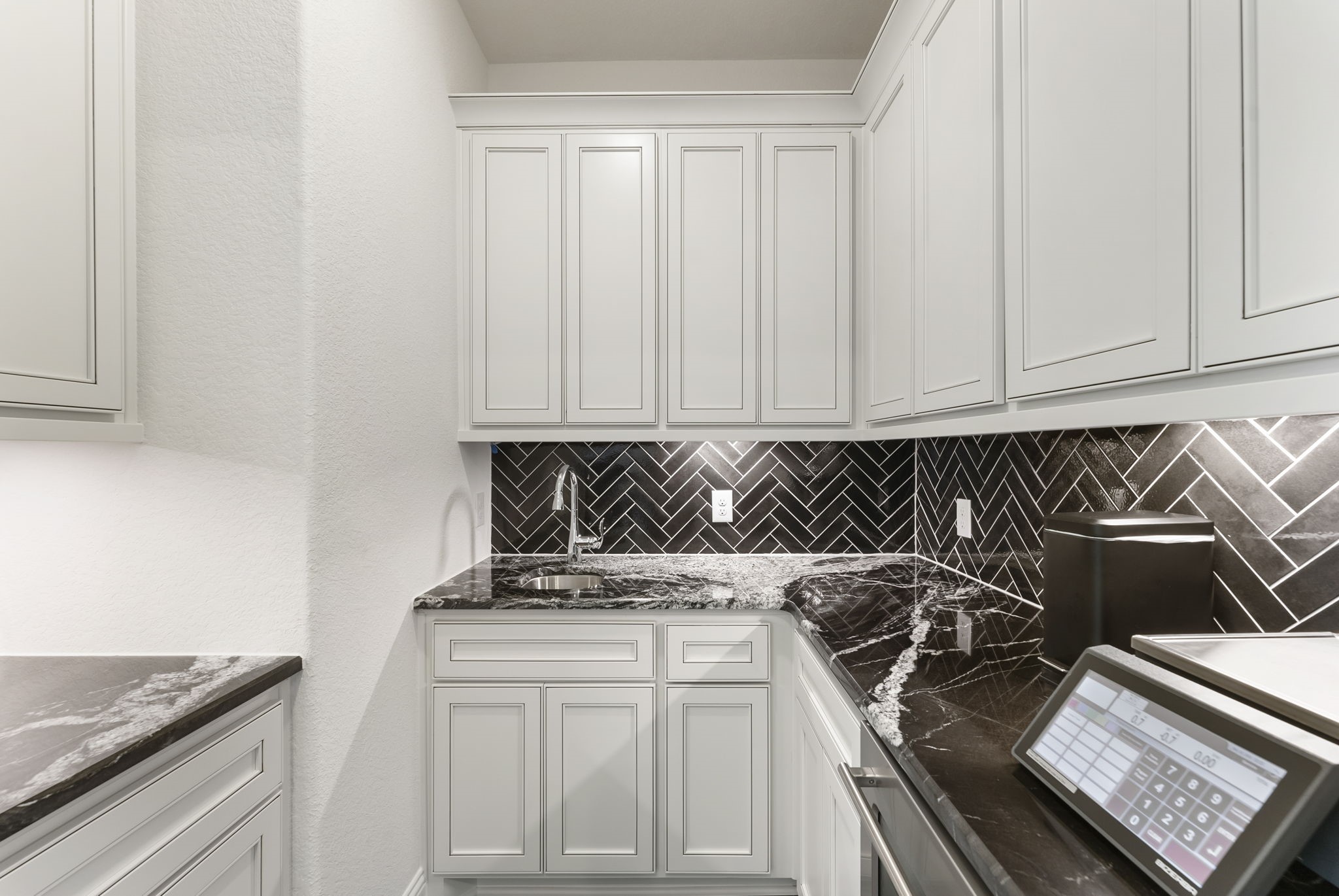 12932 Whitewater Way Conroe, TX 77302 - Photo 25 of 48 The second-floor flex space is enhanced by a beautifully designed wet bar.