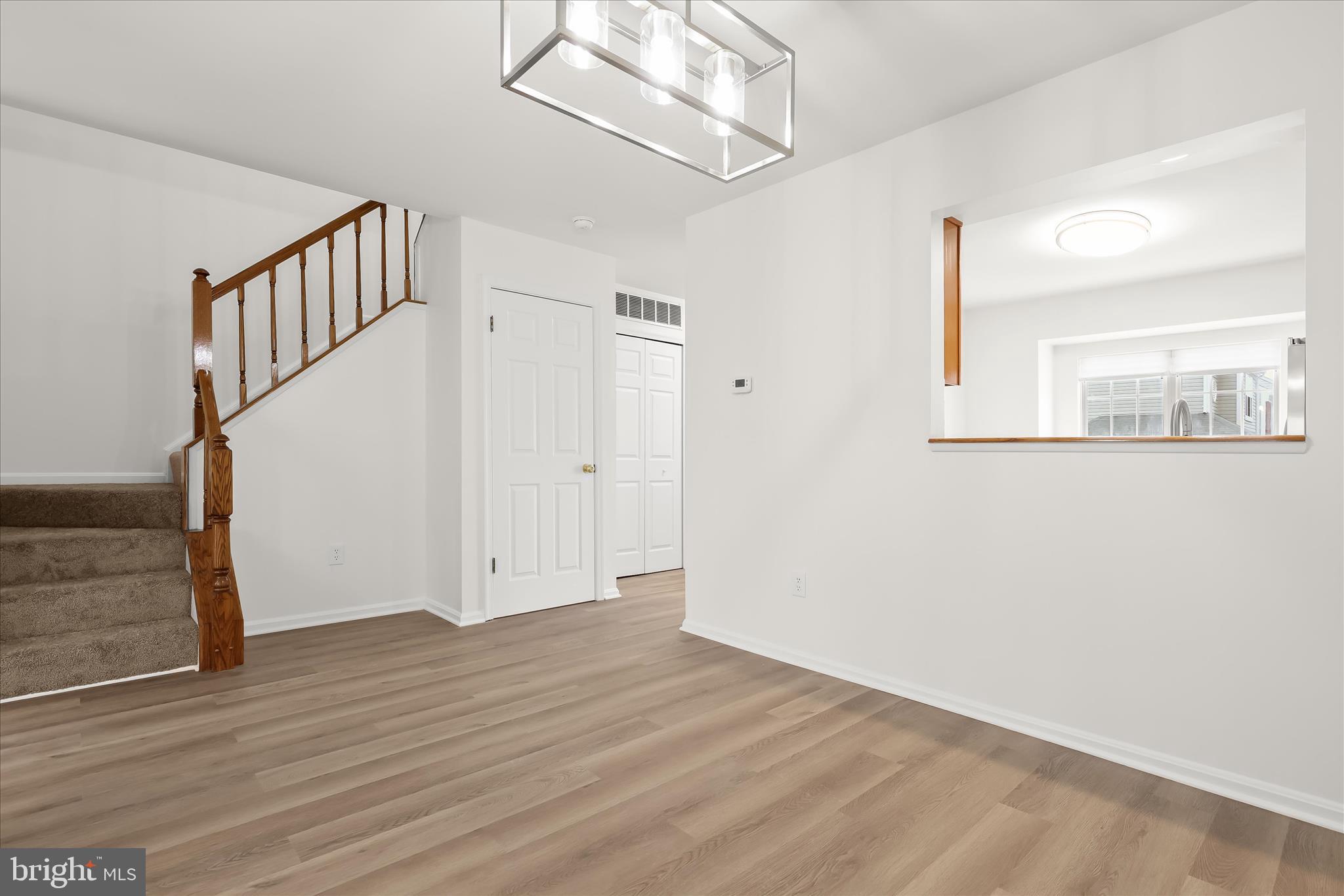 508 Greencrest Lane Odenton, MD 21113 - Photo 14 of 46 a view of an entryway with wooden floor and stairs