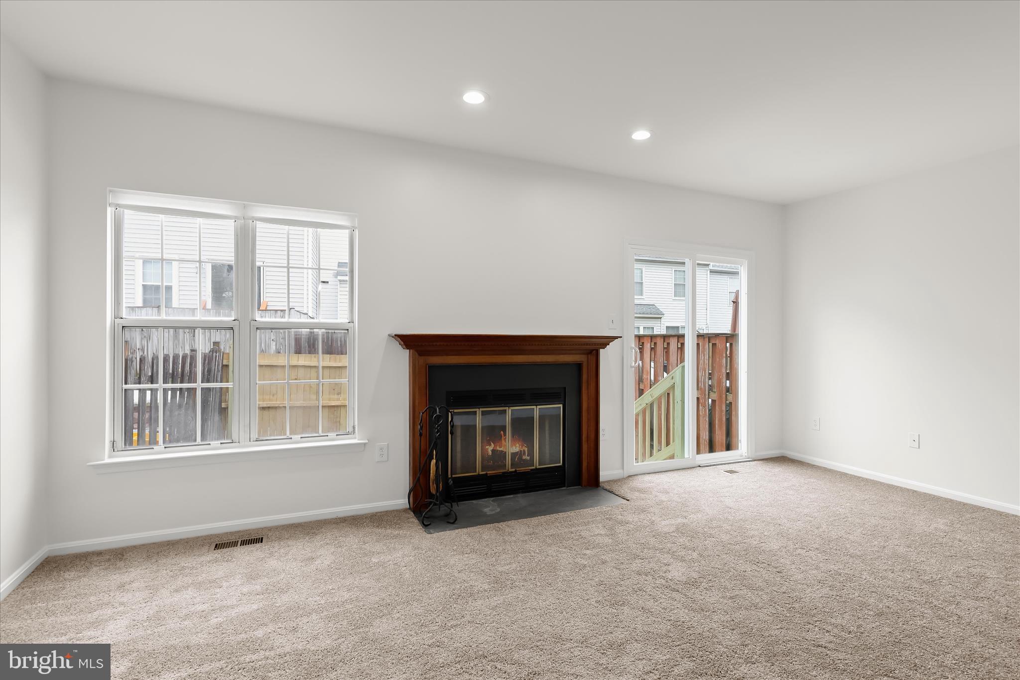 508 Greencrest Lane Odenton, MD 21113 - Photo 15 of 46 a view of an empty room with a window and fireplace