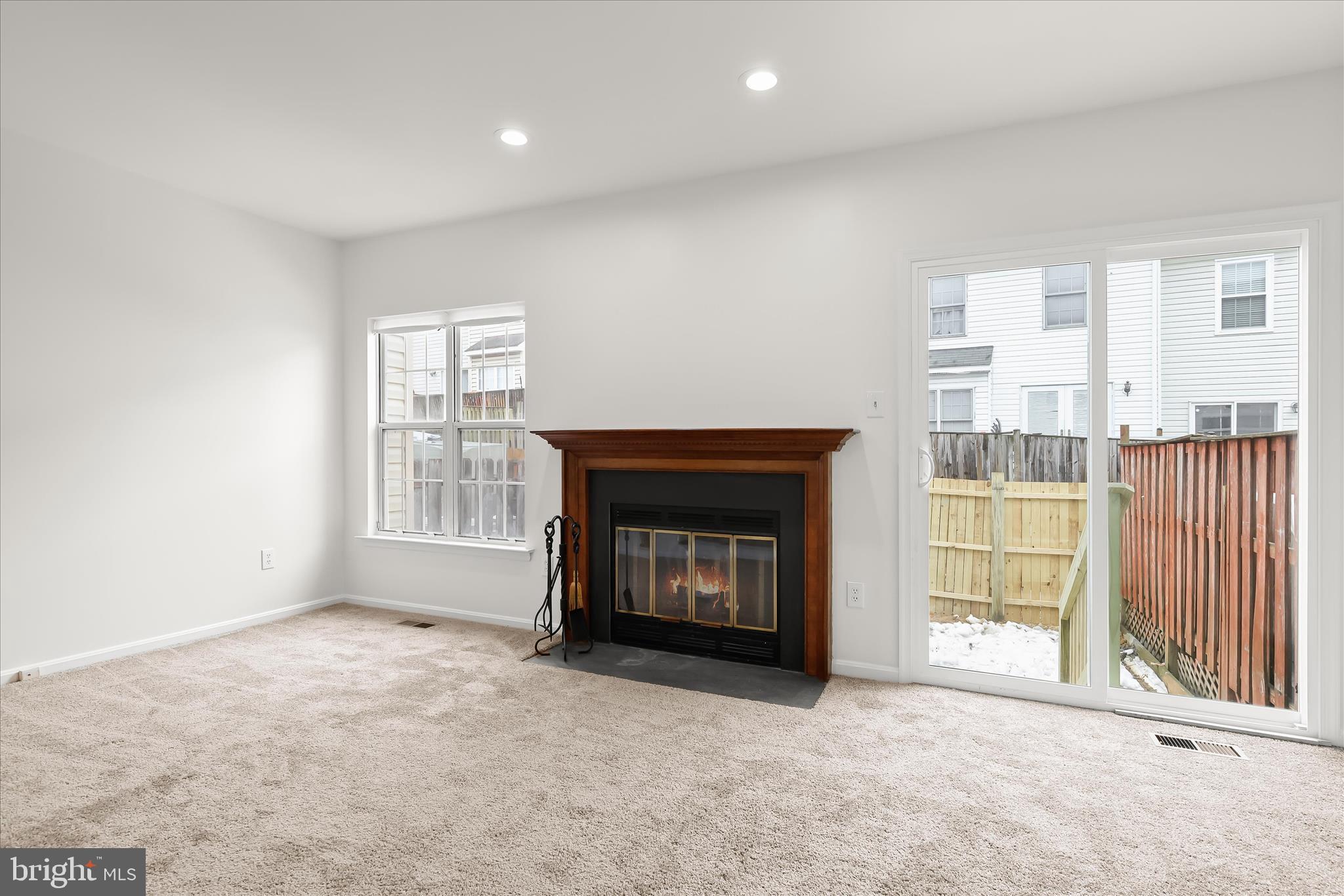 508 Greencrest Lane Odenton, MD 21113 - Photo 16 of 46 an empty room with windows and fireplace