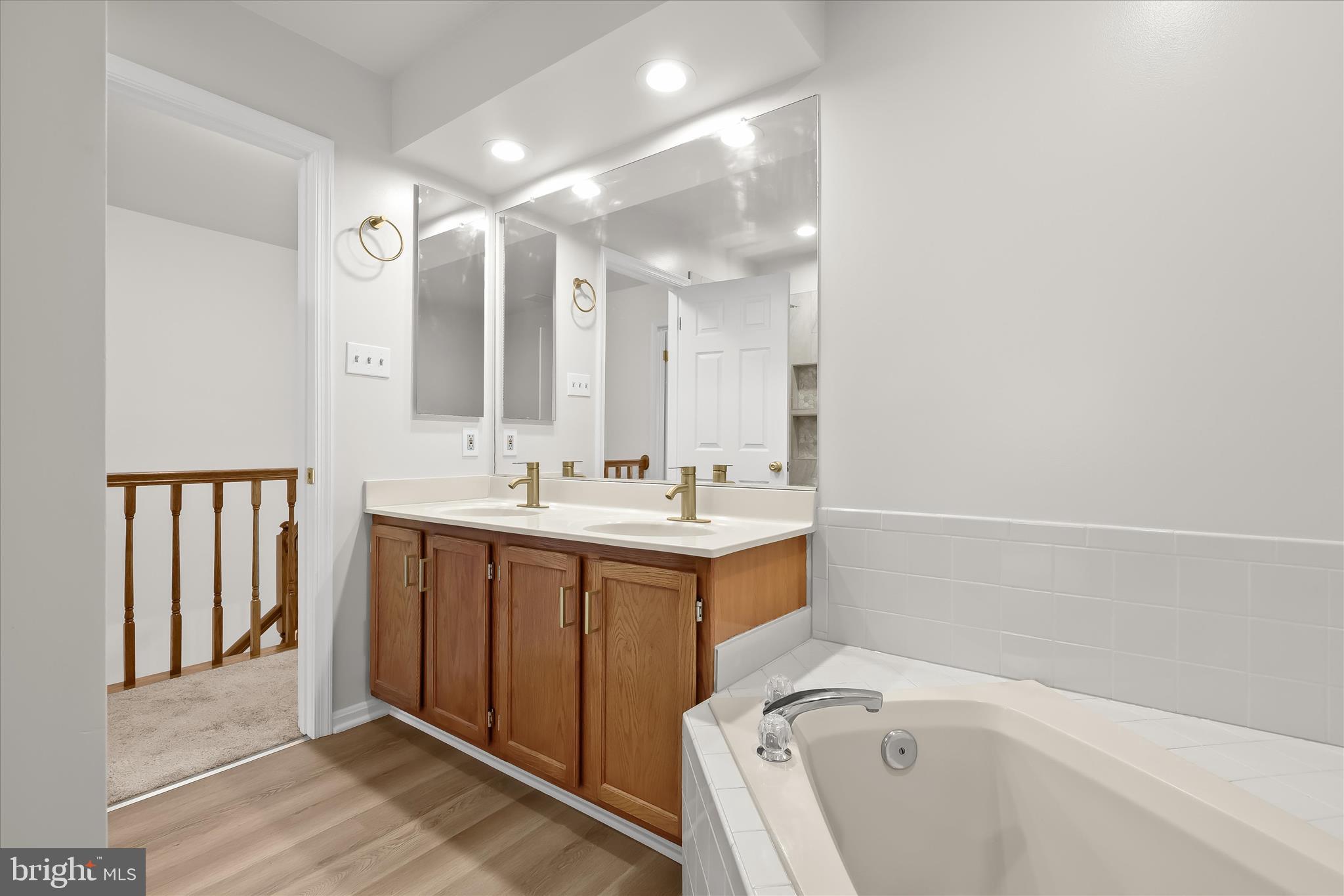 508 Greencrest Lane Odenton, MD 21113 - Photo 25 of 46 a bathroom with a sink mirror and a bathtub