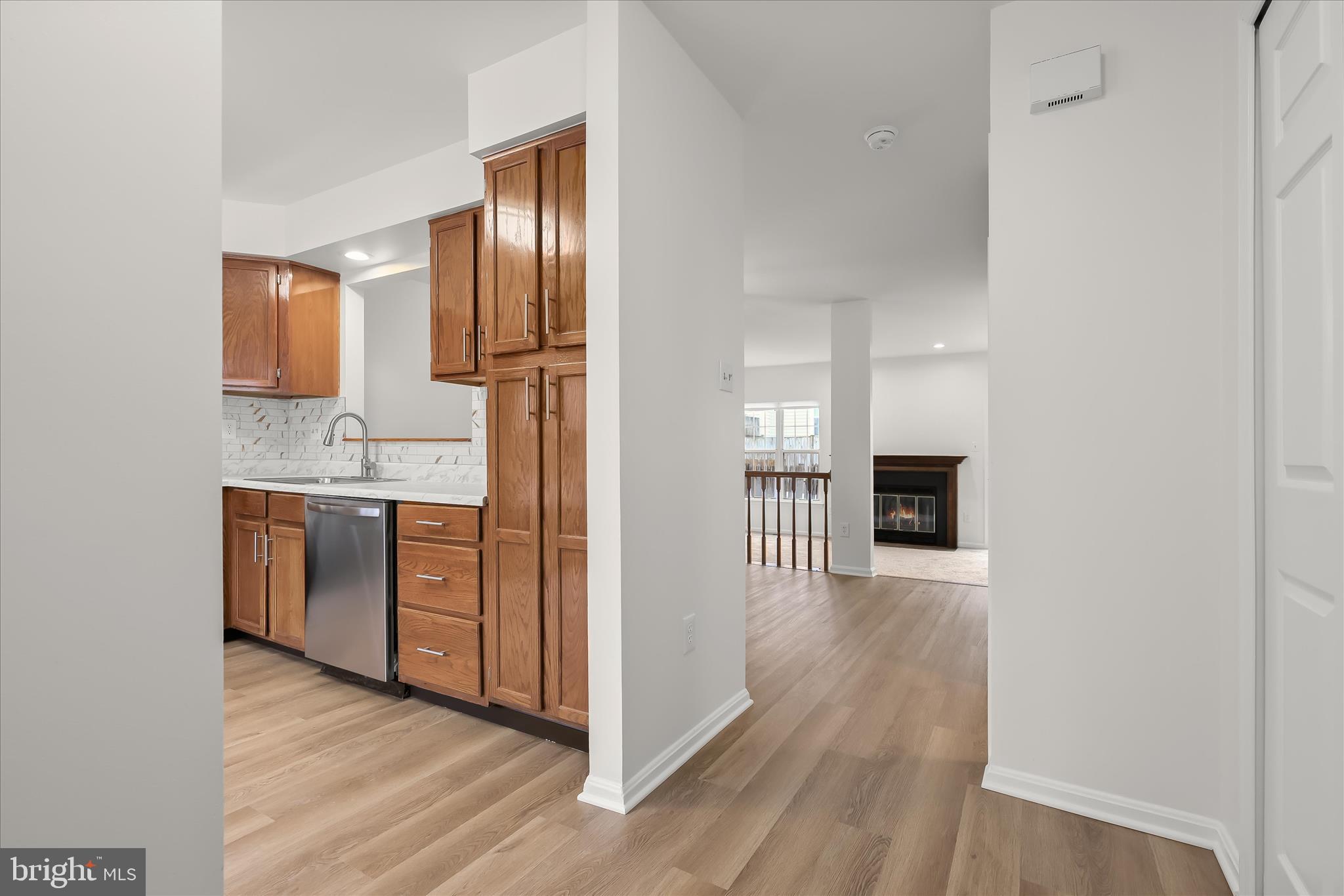 508 Greencrest Lane Odenton, MD 21113 - Photo 3 of 46 a view of a kitchen with a sink wooden floor and staircase