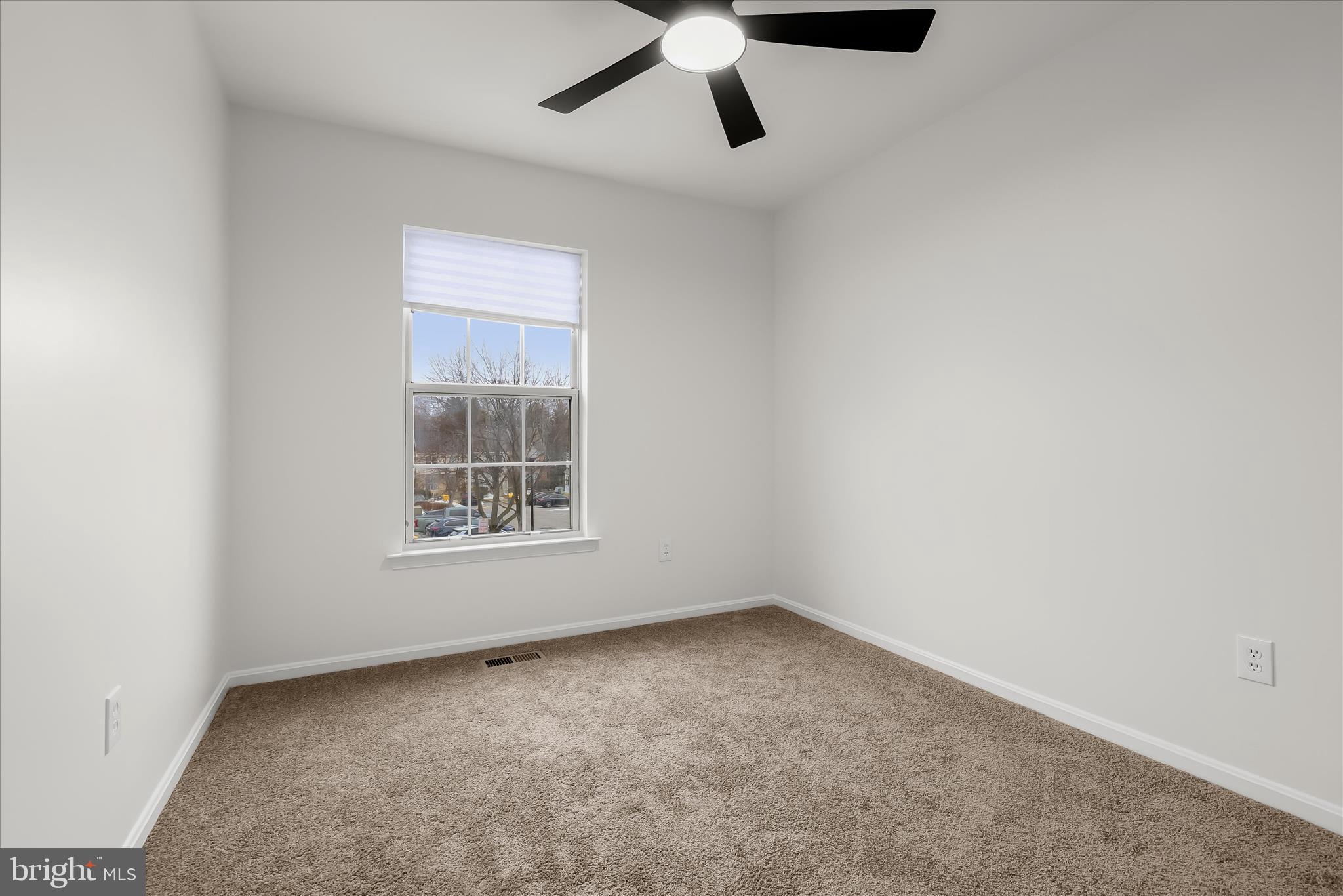 508 Greencrest Lane Odenton, MD 21113 - Photo 30 of 46 an empty room with a ceiling fan and windows