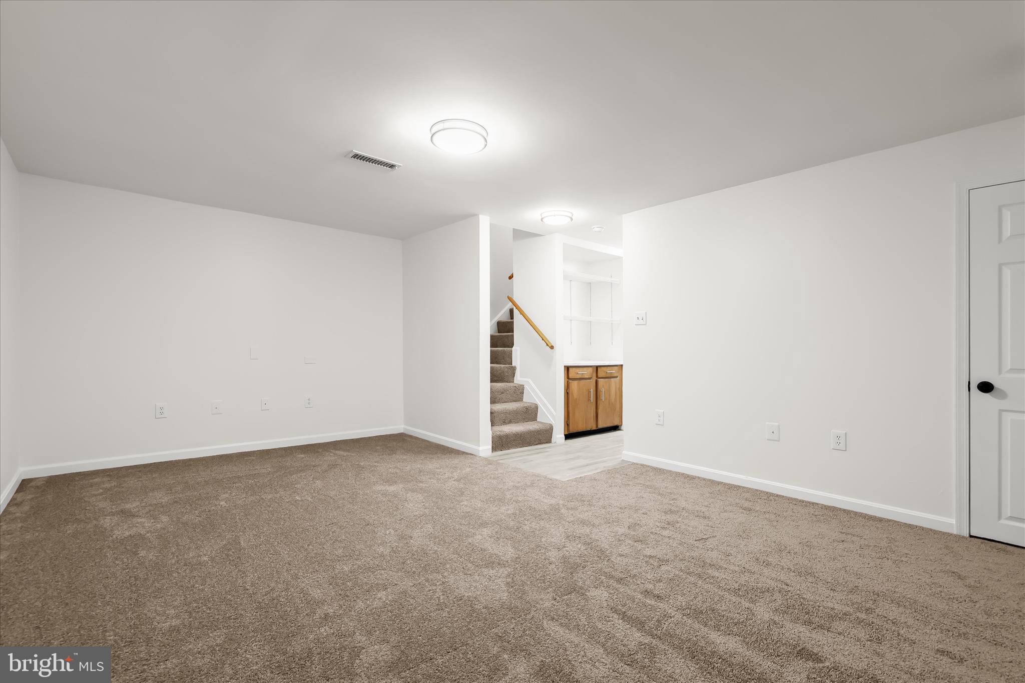 508 Greencrest Lane Odenton, MD 21113 - Photo 34 of 46 a view of an empty room with stairs