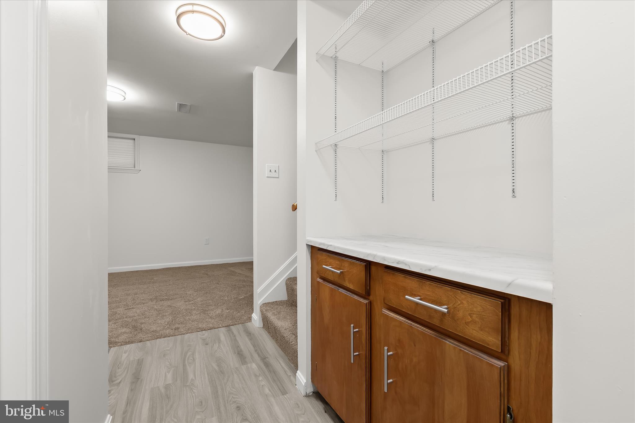 508 Greencrest Lane Odenton, MD 21113 - Photo 38 of 46 a view of storage and utility room with wooden floor