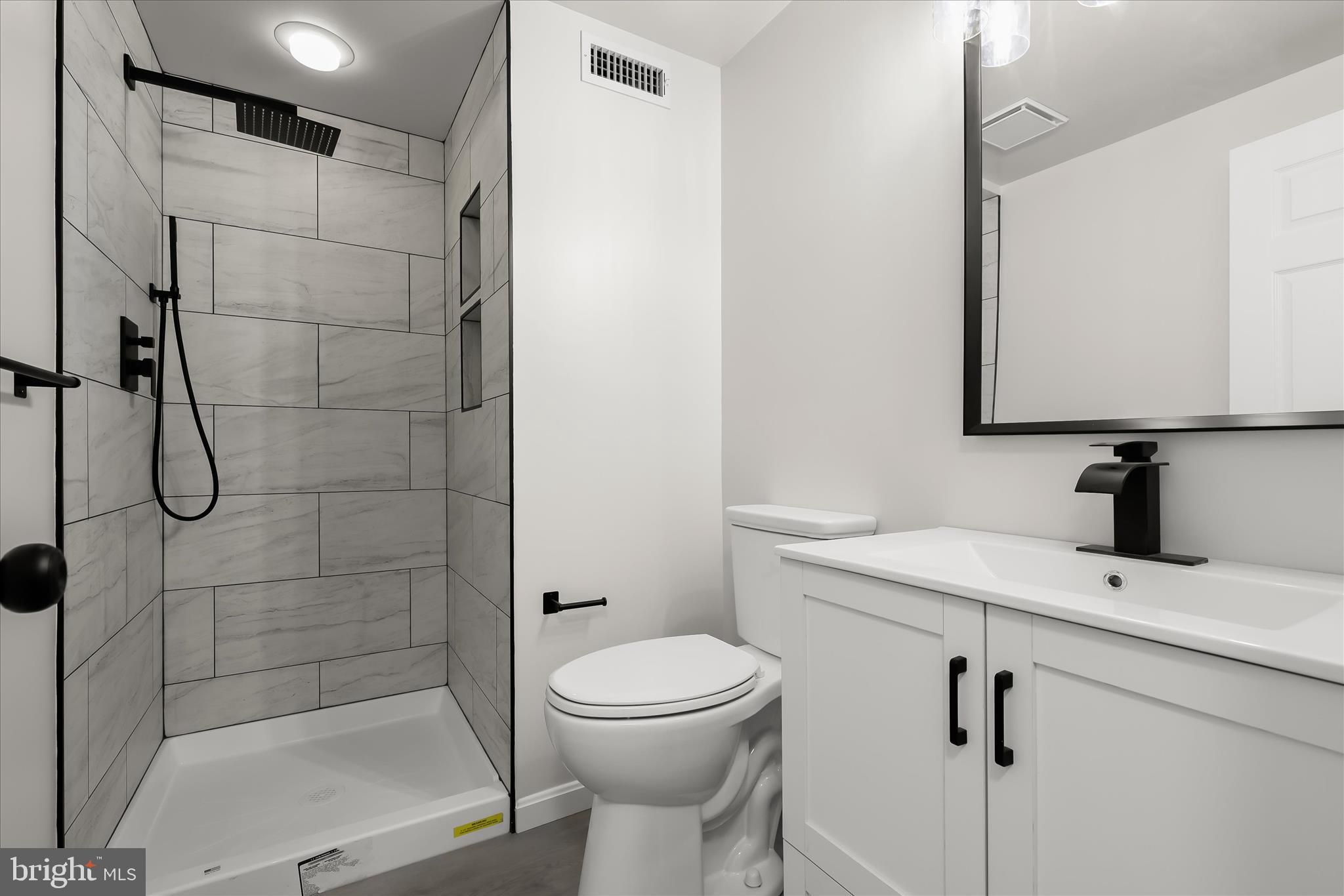 508 Greencrest Lane Odenton, MD 21113 - Photo 39 of 46 a bathroom with a sink toilet and shower