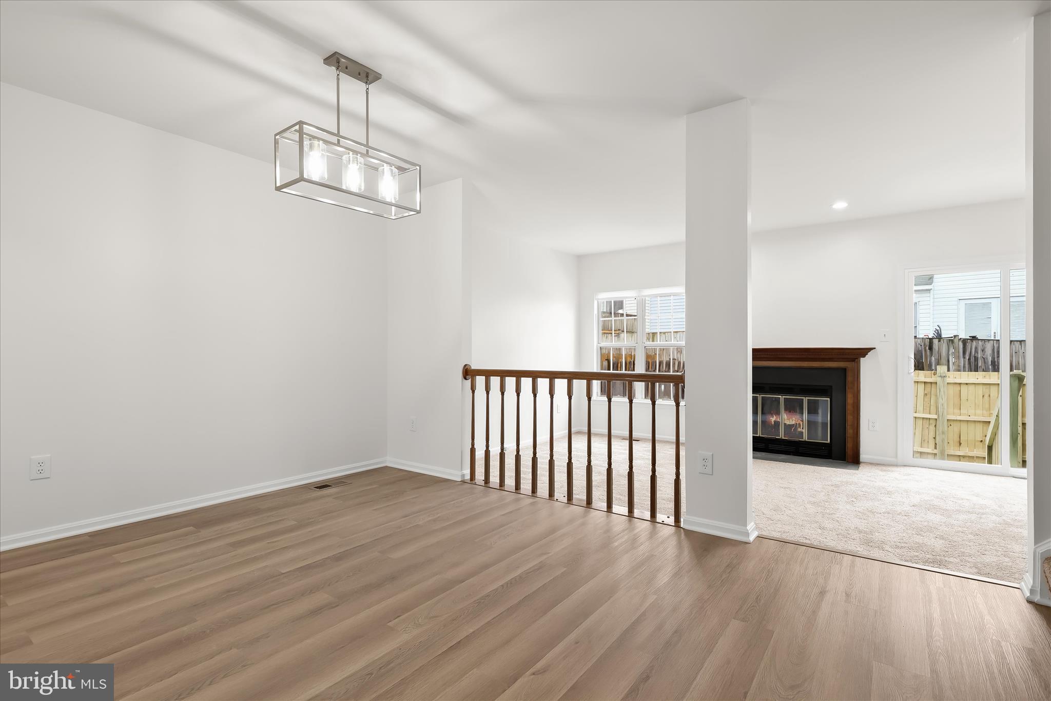 508 Greencrest Lane Odenton, MD 21113 - Photo 9 of 46 a view of a livingroom with wooden floor and a ceiling fan