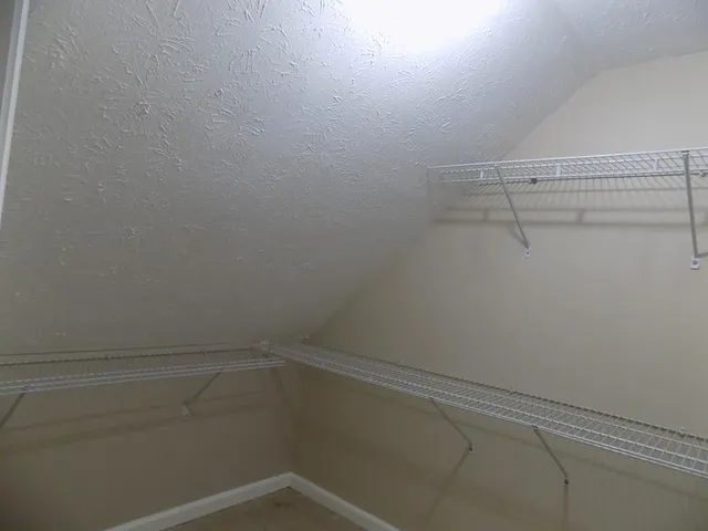 a view of a room with racks on the wall