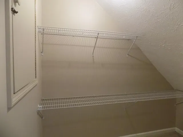 a view of a room with racks on the wall