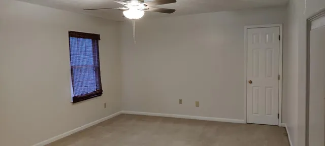 a view of a hallway with a chandelier