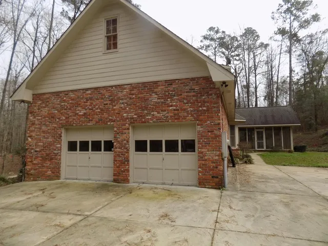 a view of house with trees in the background