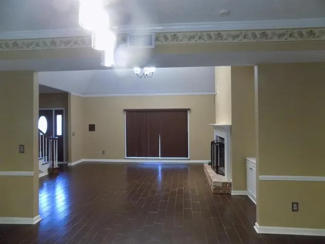a view of a livingroom with wooden floor