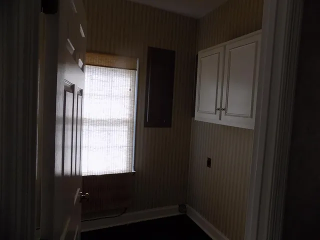 a view of an empty room and window