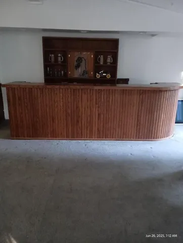 a backyard of a house with flower plants