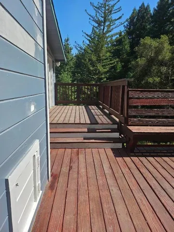 a view of deck with wooden floor and outdoor seating