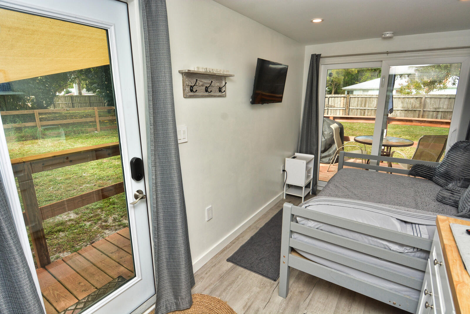 Tbd Southeast Iris Street Stuart, FL 34997 - Photo 12 of 33 a view of room with wooden floor and a flat screen tv