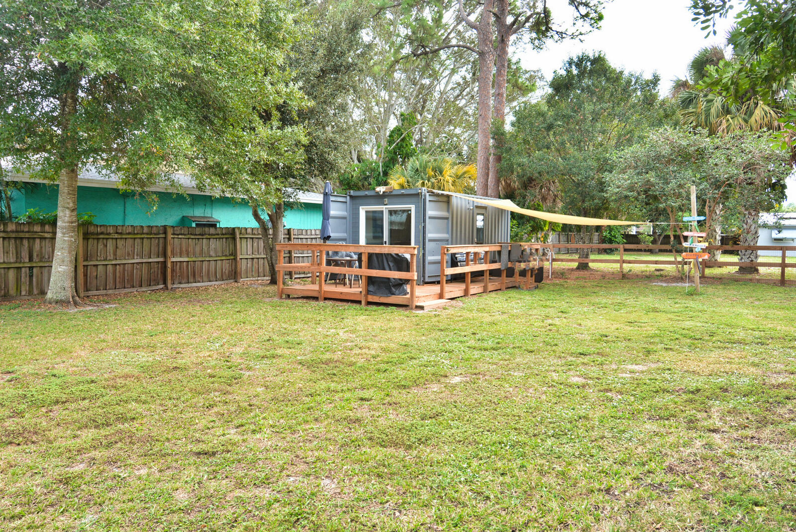 Tbd Southeast Iris Street Stuart, FL 34997 - Photo 21 of 33 a view of a house with a backyard and a patio