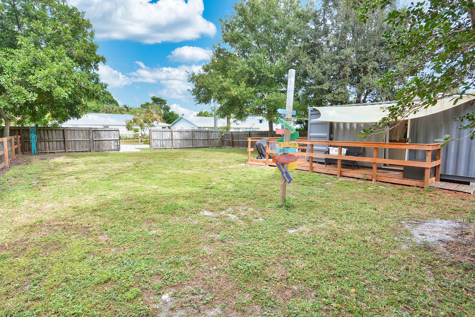 Tbd Southeast Iris Street Stuart, FL 34997 - Photo 22 of 33 a view of a house with a yard porch and sitting area
